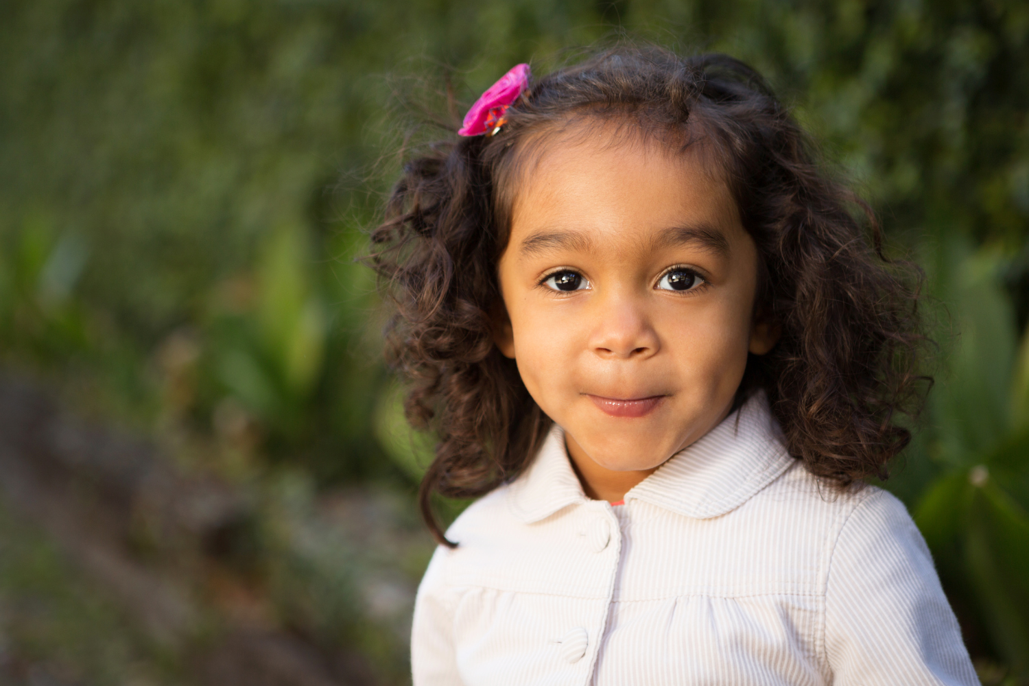 Little girl smiling into the camera