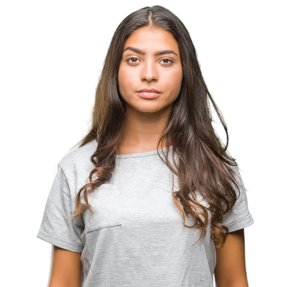 Young beautiful arab woman with serious expression on face. Simple and natural looking at the camera.